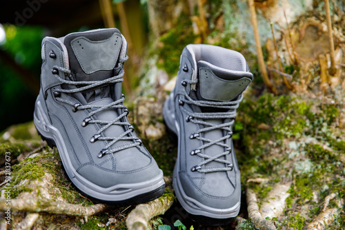 Elegant brand new hiking boots in natural environment