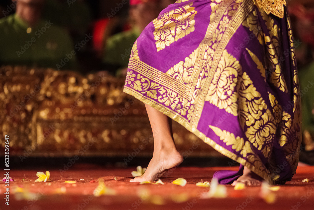 Foot of traditional Legong dancer and flowers, Ubud, Bali, Indonesia