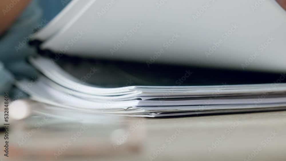 Zoom of woman hands, organise paper or search for document in paperwork stack on table at work. Lady use fingers to find report, information on pages or file on desk while working in closeup portrait