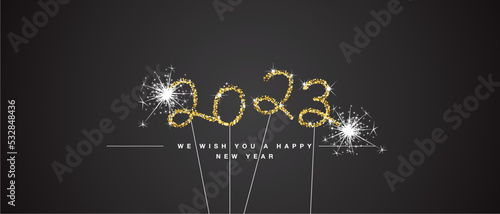 We wish you Happy New Year 2023 eve handwritten tipography golden glitter stars sparkler fireworks black background greeting card