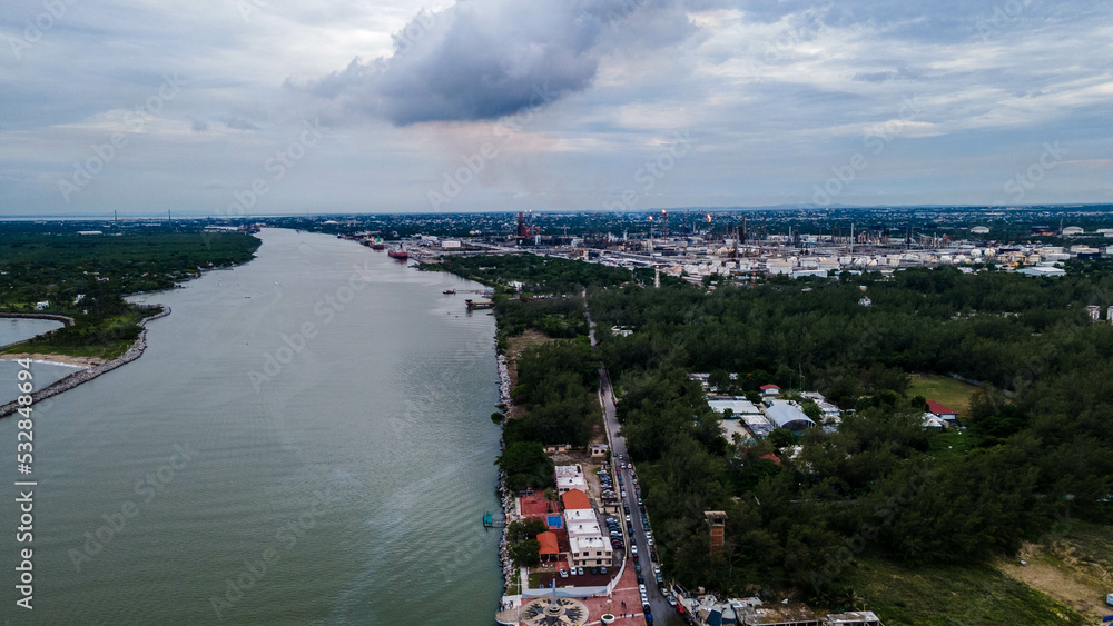 Obraz premium Rio Pánuco, A view from above of the ocean waves crushing on the rocks in Tampico, Veracruz, Mexico, Playa Miramar