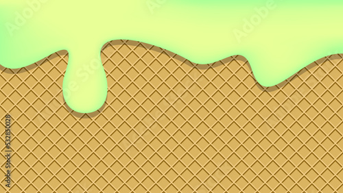 Pistachio ice cream drips onto a waffle cone. Lemon Ice cream background.