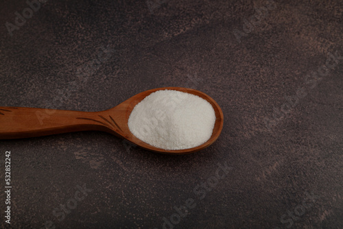 Lupin Flour in wooden bowl on grey background, top view. Versatile Lupin Flour is rich in high quality protein and complex carbohydrates. Gluten free food, nutritional digestible product