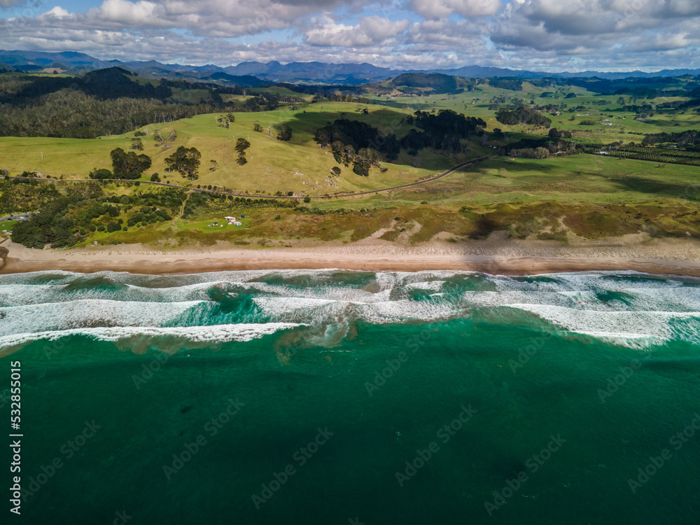 Morning surf over Hot Water Beach, Coromandel Peninsula in New Zealand's North Island