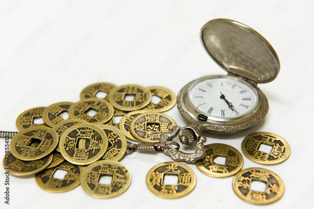 An old pocket watch and ancient Chinese coins, nostalgic plot.