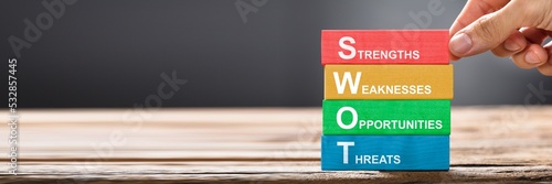 Obraz na płótnie Hand Building Colorful SWOT Concept With Wooden Blocks