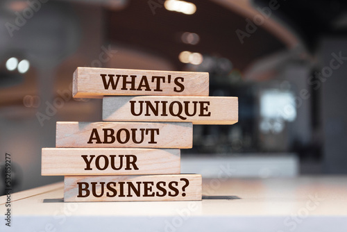 Canvas Print Wooden blocks with words 'What's Unique About Your Business?'.
