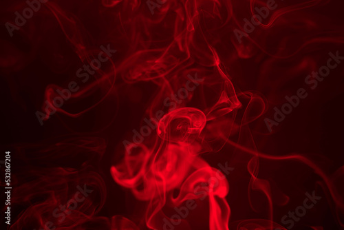 Red smoke on a black background