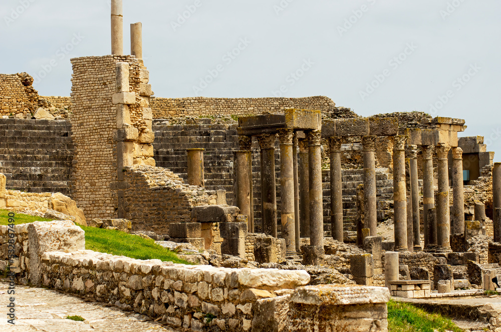 Columns and stone walls amidst the ancient ruins, Thuburbo Majus, Tunisia