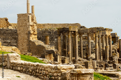 Columns and stone walls amidst the ancient ruins, Thuburbo Majus, Tunisia