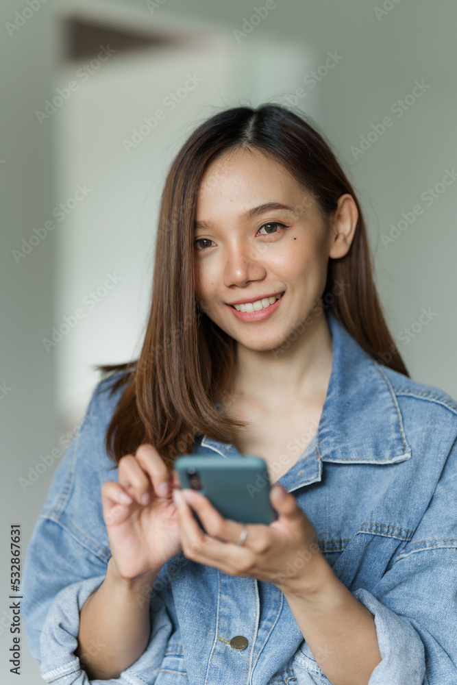 Young happy pretty asian woman using mobile smartphone for shopping online, cashless society concept. Young happy pretty asian woman using mobile smartphone for shopping online, cashless society concept.
