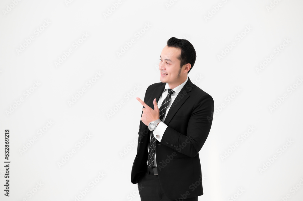 Young Asian handsome, wearing a black suit and celebrating victory isolated on white background. Young Asian handsome, wearing a black suit and celebrating victory isolated on white background.