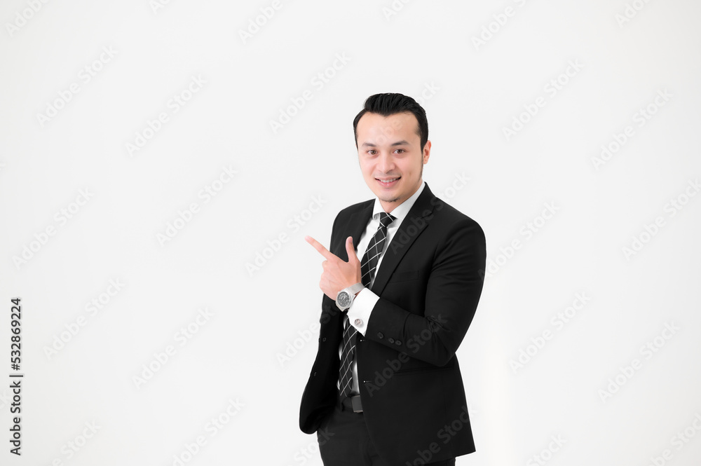 Young Asian handsome, wearing a black suit and celebrating victory isolated on white background.