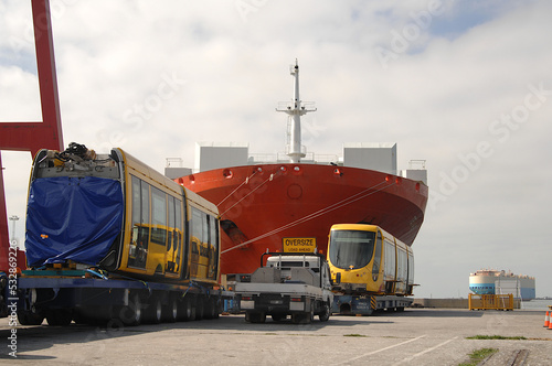 articulated tram made in France arrives at Web Dock on huge carrier vessel called Texas