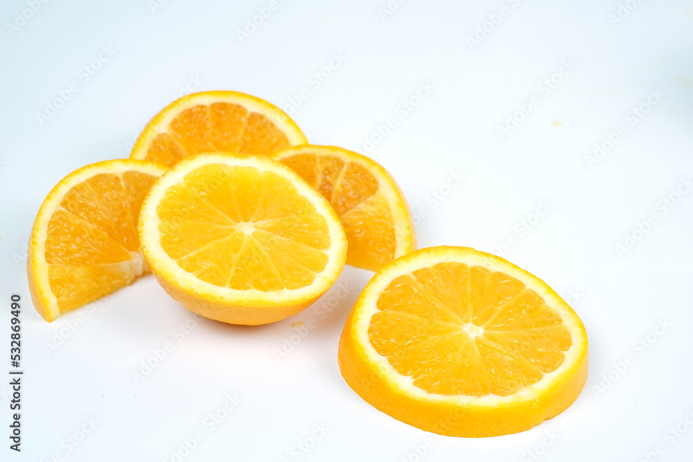 Set with tasty ripe slices of orange on white background Set with tasty ripe slices of orange on white background