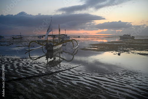 Fishing Boats at Dawn Low Tide, Sanur, Bali Indonesia photo