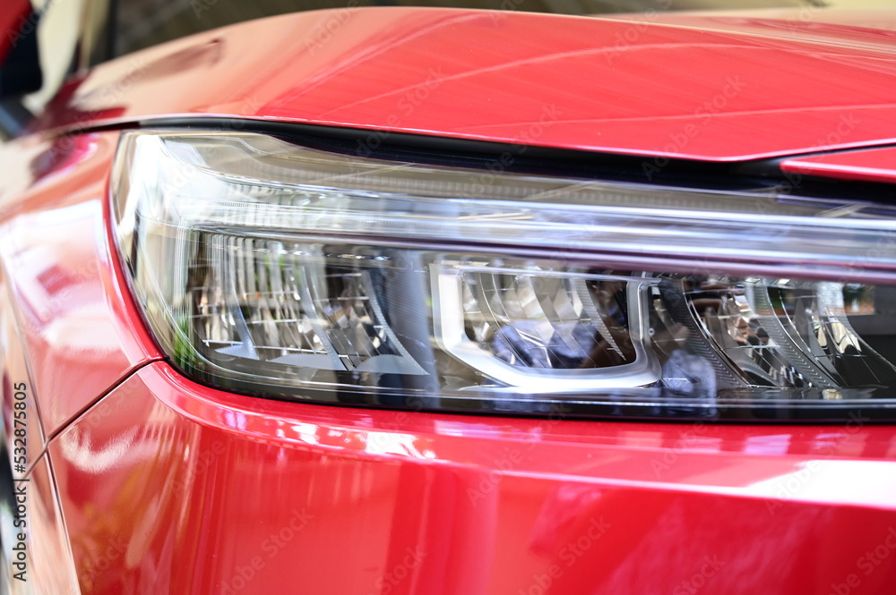 headlight of red car, transportation industry