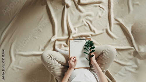Pregnancy, maternity, eco sustainable lifestyle, gynecology concept. Banner. Pregnant woman writing baby names list at home. New life, wellbeing, fertility, unborn baby health. Banner, copy space