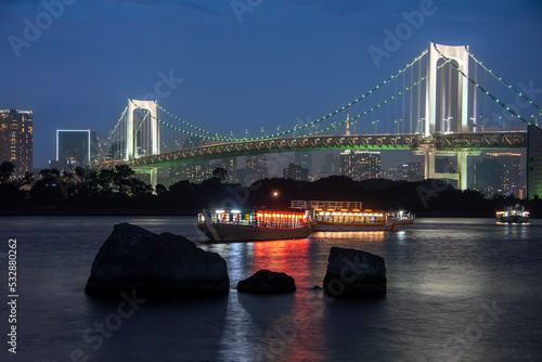 Photography Yakatabune party boats at night by Rainbow Bridge in tokyo
