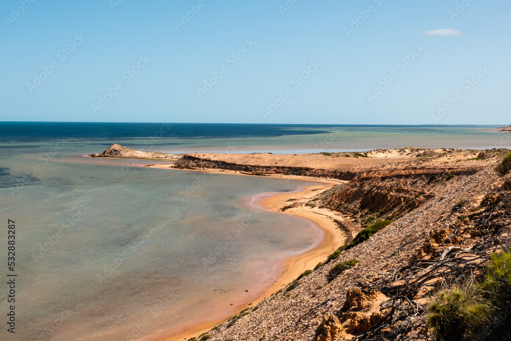 beautiful coastline with rocks and yellow sand in shark bay , Australia