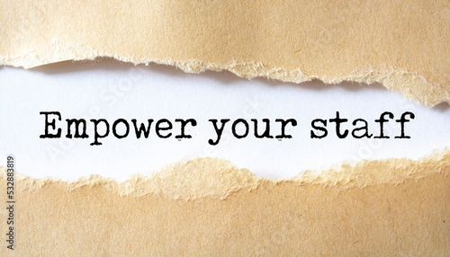 Empower your staff word written under torn paper concept.
