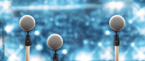 Microphones Public speaking background, Close up microphone on stand for speaker speech presentation stage performance or press conference backgrounds.