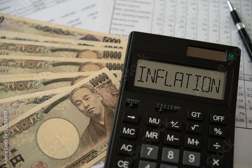 Inflation yen concept. inflation word on calculator with yen money and  monetary policy to control inflation and Yen depreciates report.