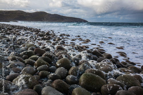 Arctic Ocean stone beach locate in Teriberka Village, Murmansk, Russia