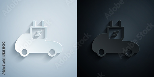 Paper cut Electric car and electrical cable plug charging icon isolated on grey and black background. Renewable eco technologies. Paper art style. Vector