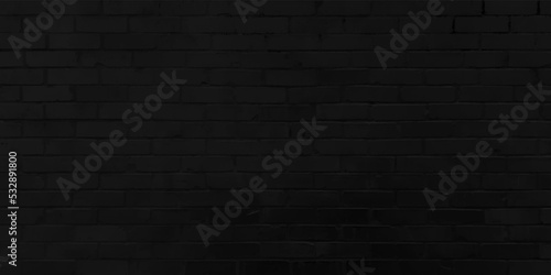 The texture of the brick is black. Background of empty brick basement wall.