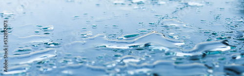 Obraz na płótnie Pattern of water drops in a shiny metallic surface with table reflections