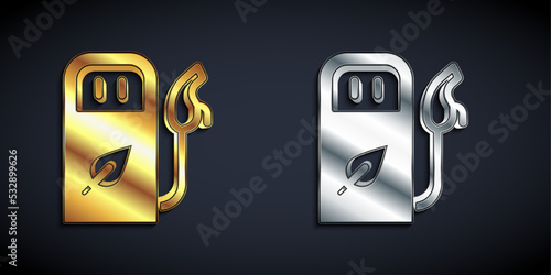 Gold and silver Petrol or gas station icon isolated on black background. Car fuel symbol. Gasoline pump. Long shadow style. Vector
