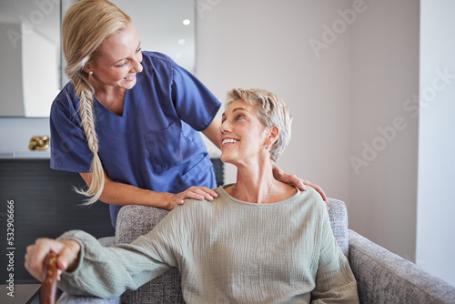 Nurse, healthcare and retirement with a senior woman and carer in a home for health, care and wellness. Medical, insurance and assisted living with an eldery female patient and a caregiver inside photo