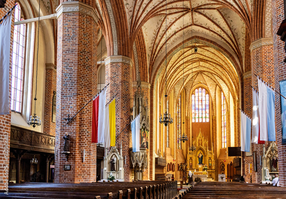 Main nave with altar and presbytery of historic Holy Mary gothic Kosciol Mariacki church in old town quarter of Trzebiatow in Poland Main nave with altar and presbytery of historic Holy Mary gothic Kosciol Mariacki church in old town quarter of Trzebiatow in Poland