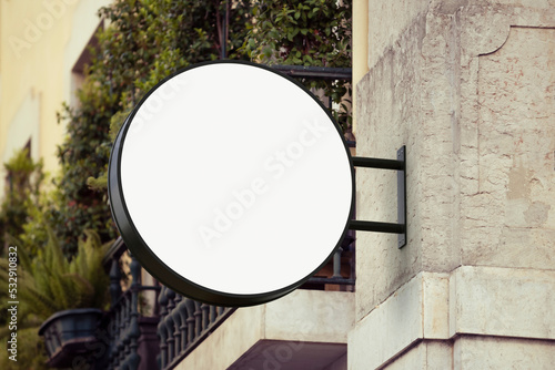 Round wall sign board mockup for cafe logo