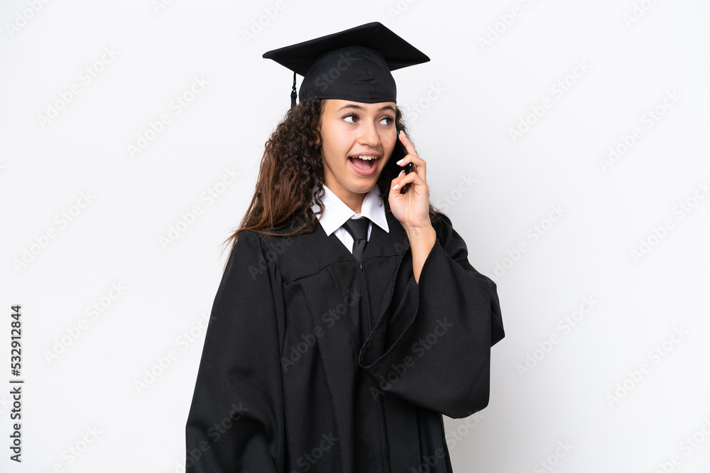 Young university graduate Arab woman isolated on white background keeping a conversation with the mobile phone Young university graduate Arab woman isolated on white background keeping a conversation with the mobile phone