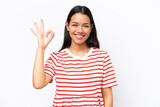 Young Colombian woman isolated on white background showing ok sign with fingers