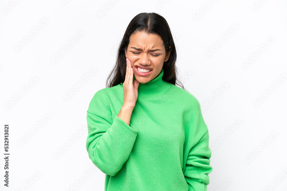 Young Colombian woman isolated on white background with toothache Young Colombian woman isolated on white background with toothache