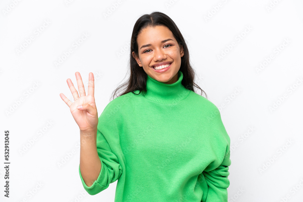 Young Colombian woman isolated on white background happy and counting four with fingers Young Colombian woman isolated on white background happy and counting four with fingers