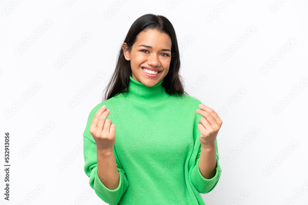 Young Colombian woman isolated on white background making money gesture Young Colombian woman isolated on white background making money gesture
