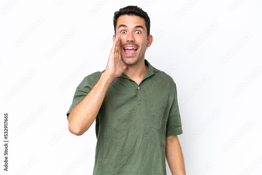 Young handsome man over isolated white background shouting with mouth wide open Young handsome man over isolated white background shouting with mouth wide open