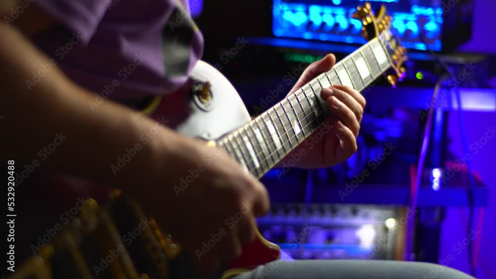 lead guitarist playing electrical guitar at studio
lead guitarist playing electrical guitar at studio