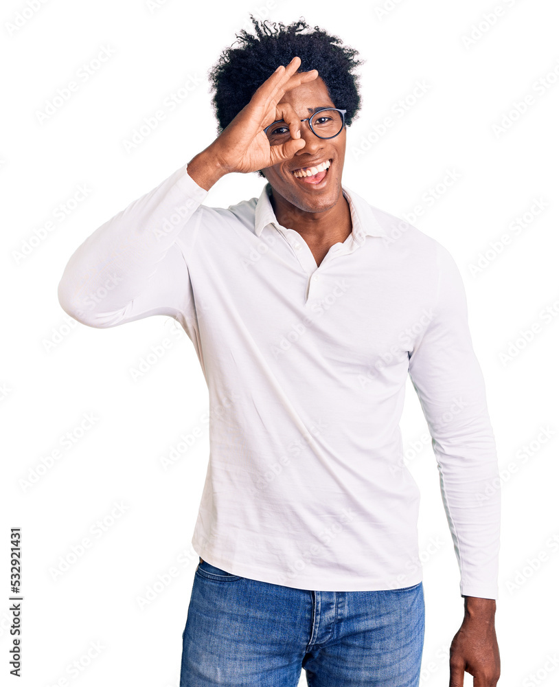 Handsome african american man with afro hair wearing casual clothes and glasses doing ok gesture with hand smiling, eye looking through fingers with happy face. Handsome african american man with afro hair wearing casual clothes and glasses doing ok gesture with hand smiling, eye looking through fingers with happy face.