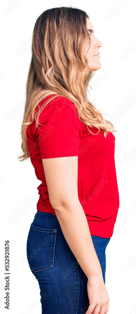 Young caucasian woman wearing casual clothes looking to side, relax profile pose with natural face with confident smile. Young caucasian woman wearing casual clothes looking to side, relax profile pose with natural face with confident smile.