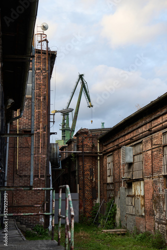 Shipyard crane visible from the alley