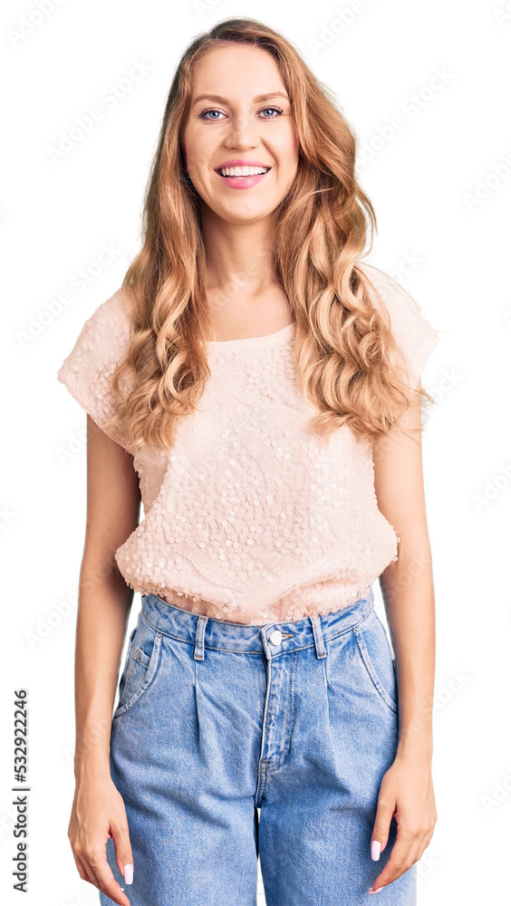 Young beautiful caucasian woman with blond hair wearing casual clothes with a happy and cool smile on face. lucky person. Young beautiful caucasian woman with blond hair wearing casual clothes with a happy and cool smile on face. lucky person.