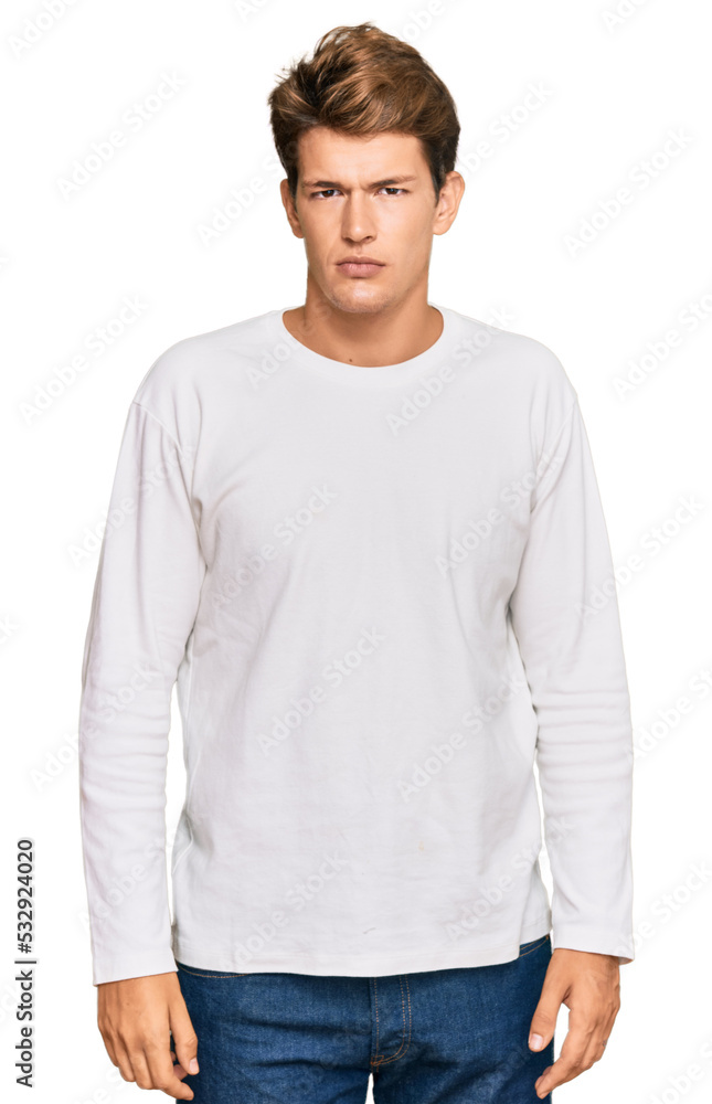Fototapeta premium Handsome caucasian man wearing casual white sweater relaxed with serious expression on face. simple and natural looking at the camera.