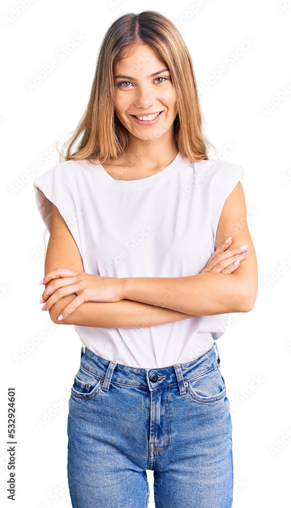 Fototapeta premium Beautiful caucasian woman with blonde hair wearing casual white tshirt happy face smiling with crossed arms looking at the camera. positive person.