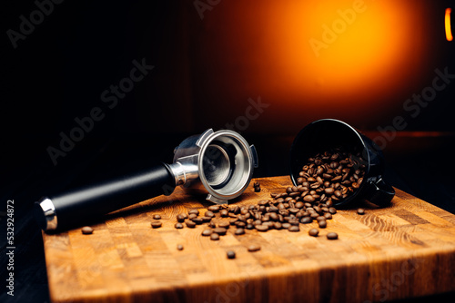 Scattered coffee beans on a wooden board. Coffee background