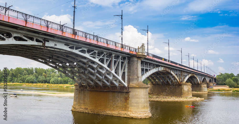 Fototapeta premium Historic Slasko-Dabrowski Bridge over the Wisla river in Warsaw, Poland